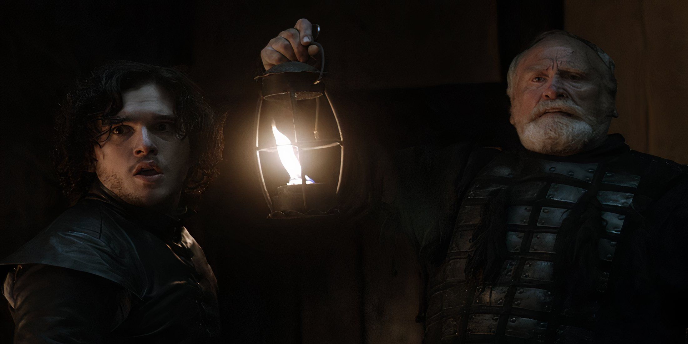 Jon Snow, a light, and Jeor Mormont in Game of Thrones