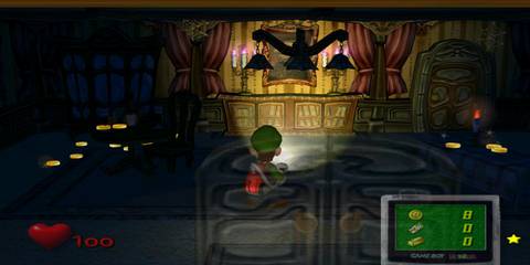 Luigi holding a torch light in Luigi's Mansion