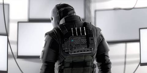 Vigil standing in front of screens