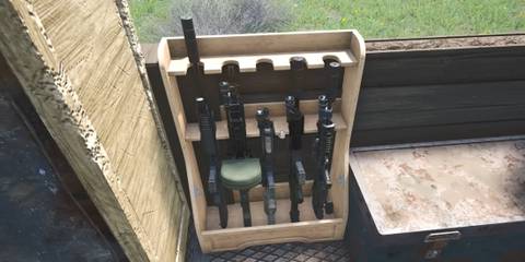 SCUM best weapons featured image gun rack