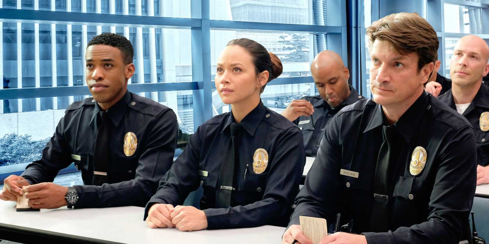Titus Makin Jr., Melissa O'Neil and Nathan Fillion in The Rookie