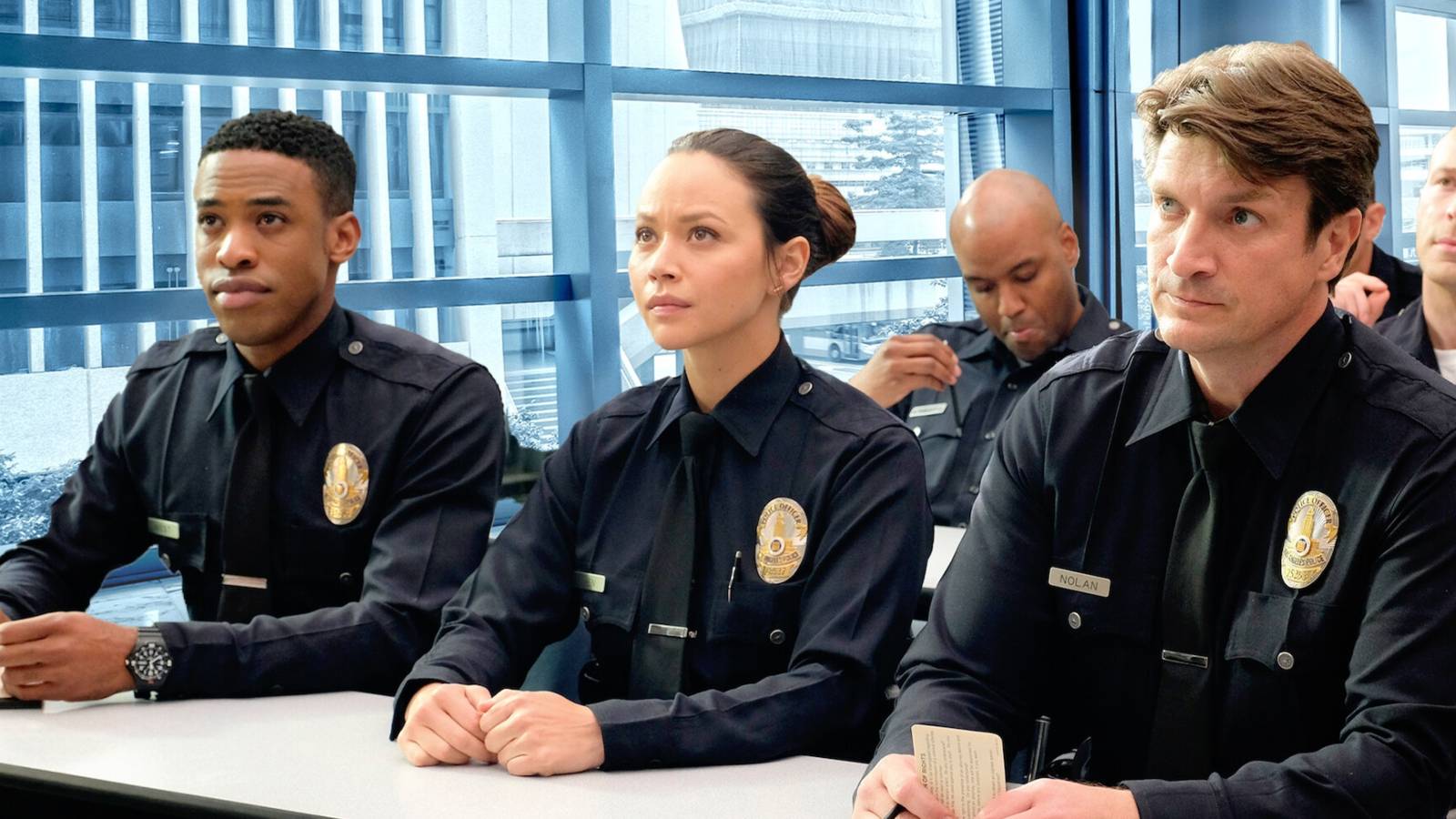 Titus Makin Jr., Melissa O'Neil and Nathan Fillion in The Rookie