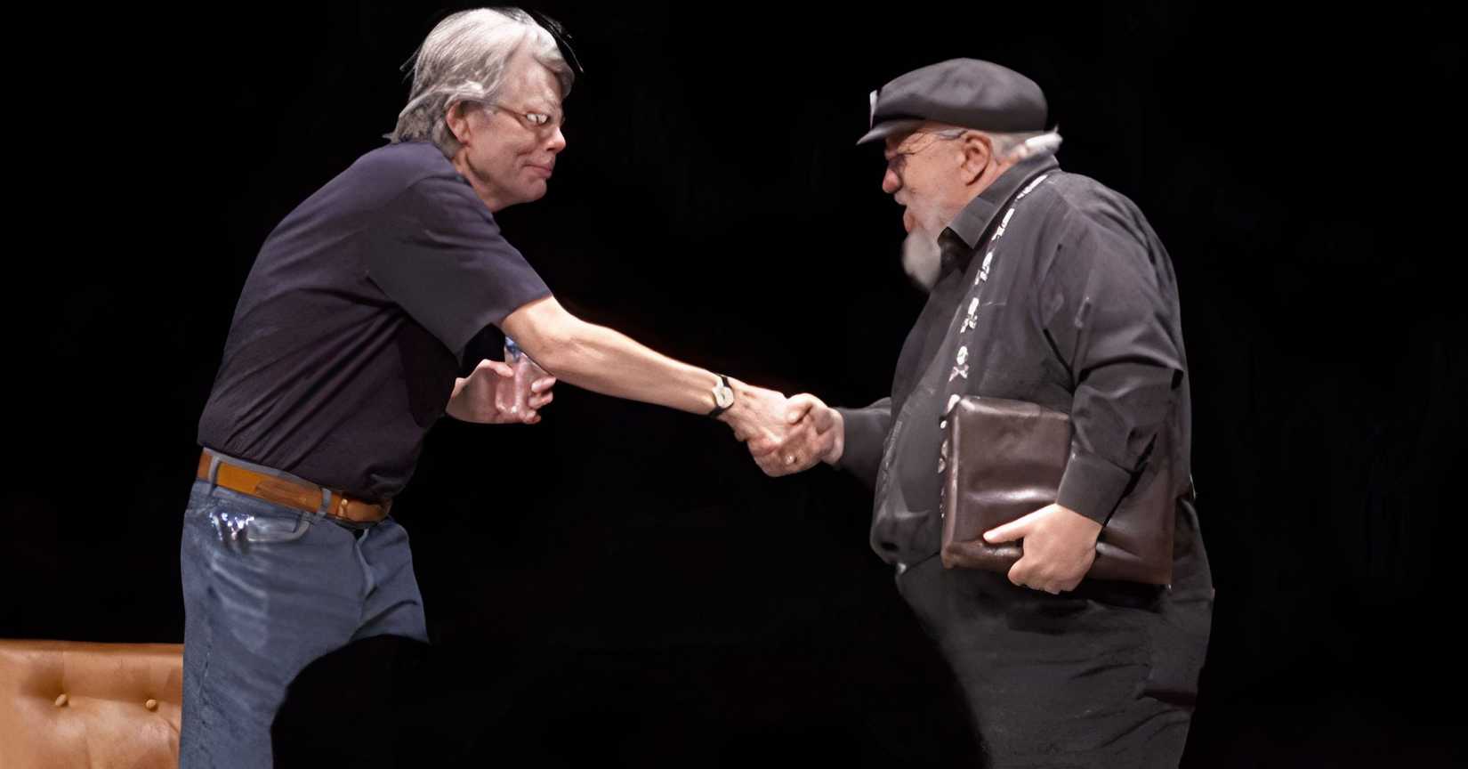Stephen King and George R.R Martin shaking hands