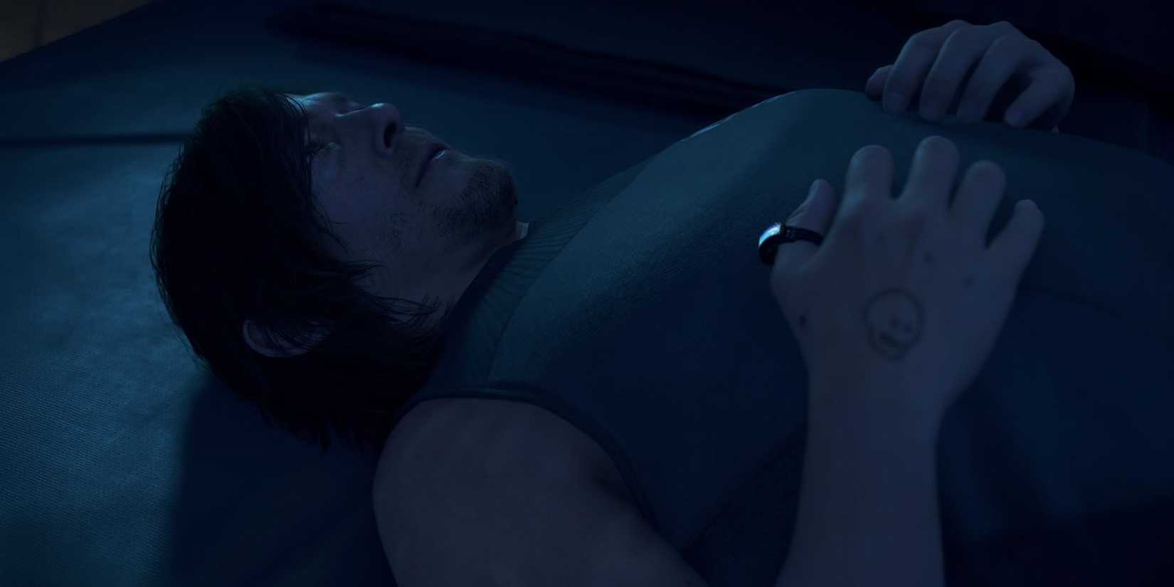 Sam lying in the dark in Death Stranding 2: On The Beach