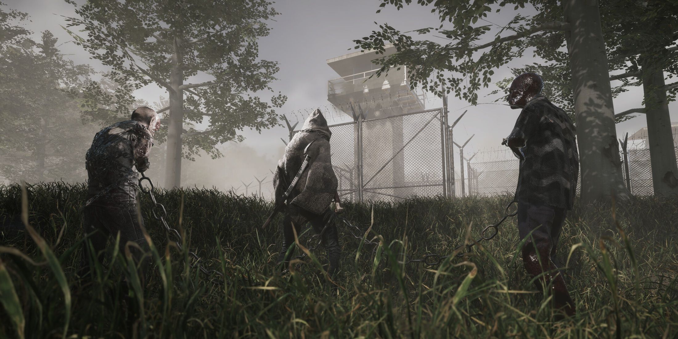 Michonne leads two chained walkers through tall grass outside a fenced prison in The Walking Dead: Destinies