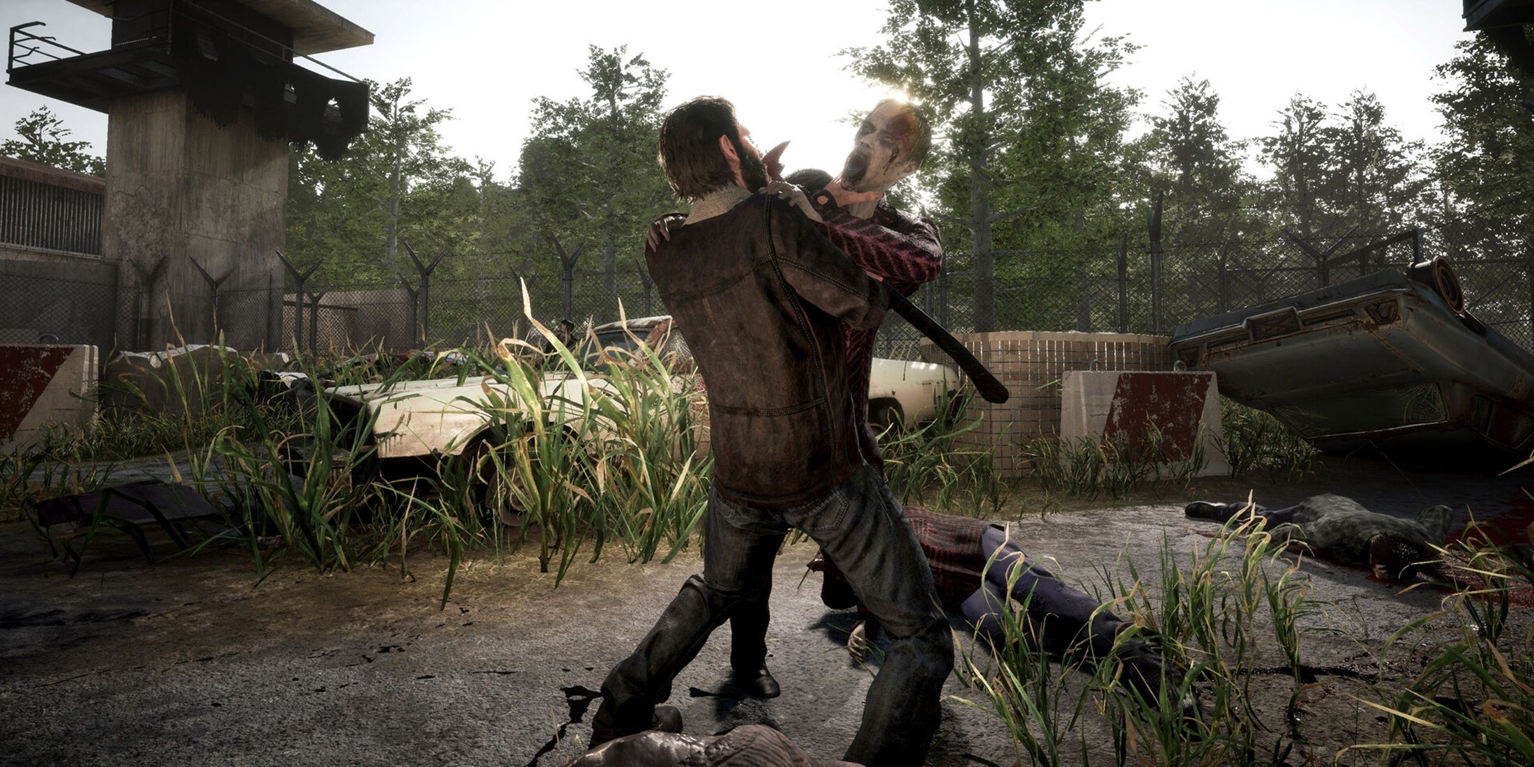 Rick battles a walker hand-to-hand outside a guard tower.
