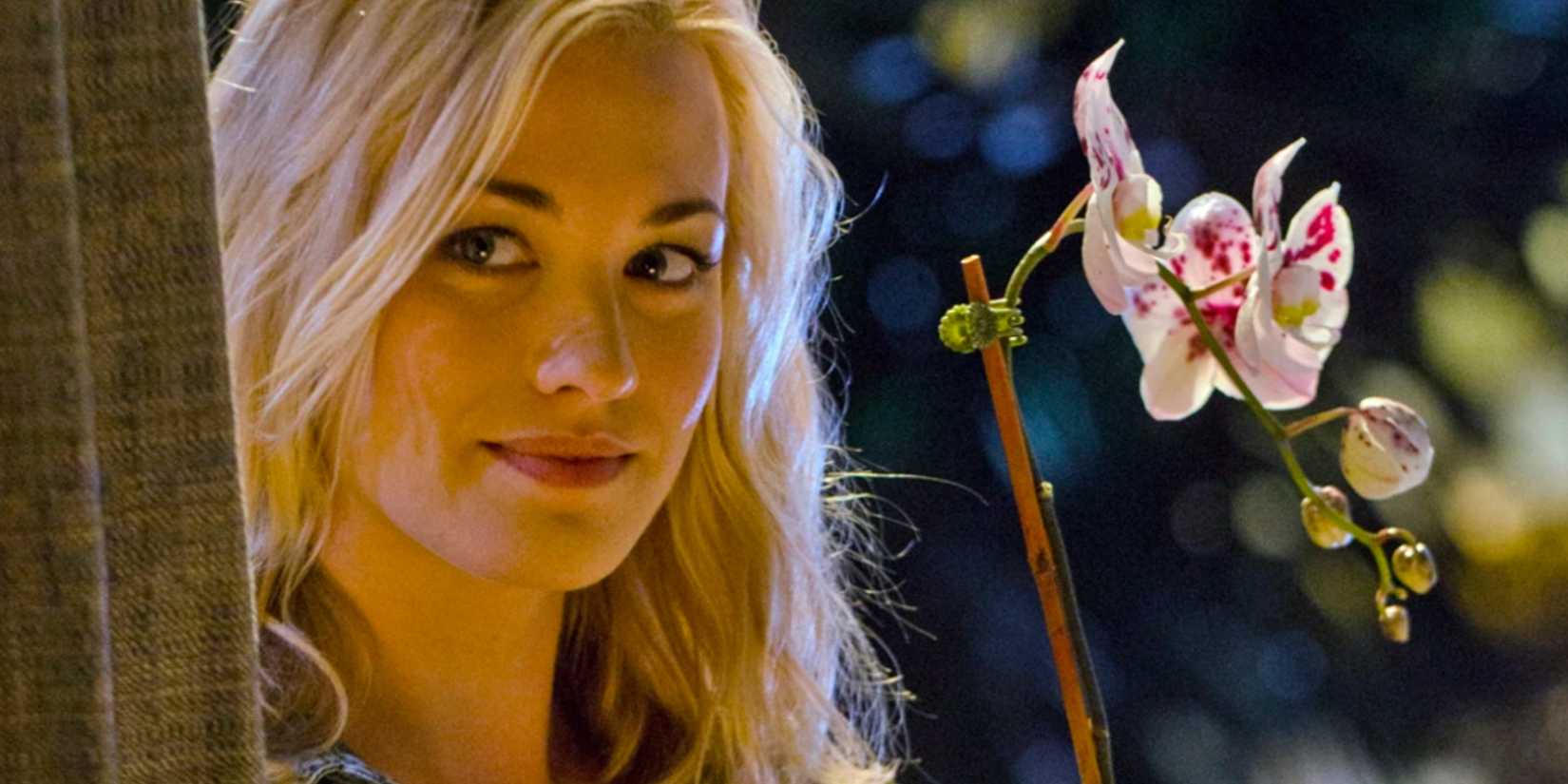 Hannah McKay with a flower