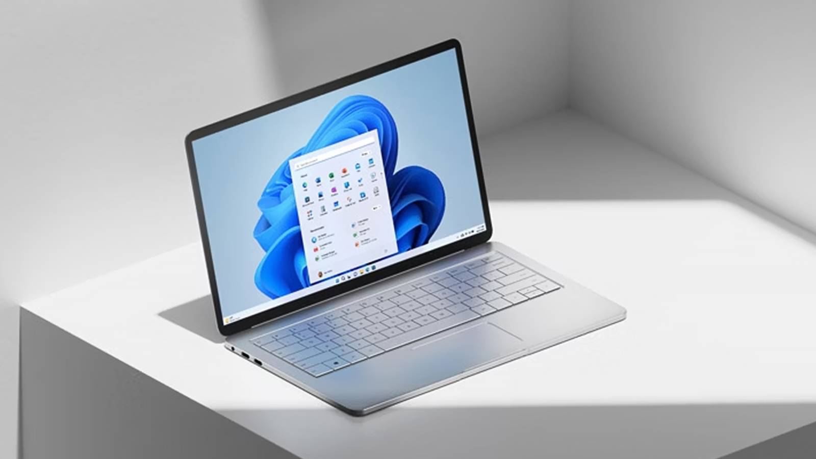 Microsoft Windows 11 laptop promo lifestyle shot photo gray background