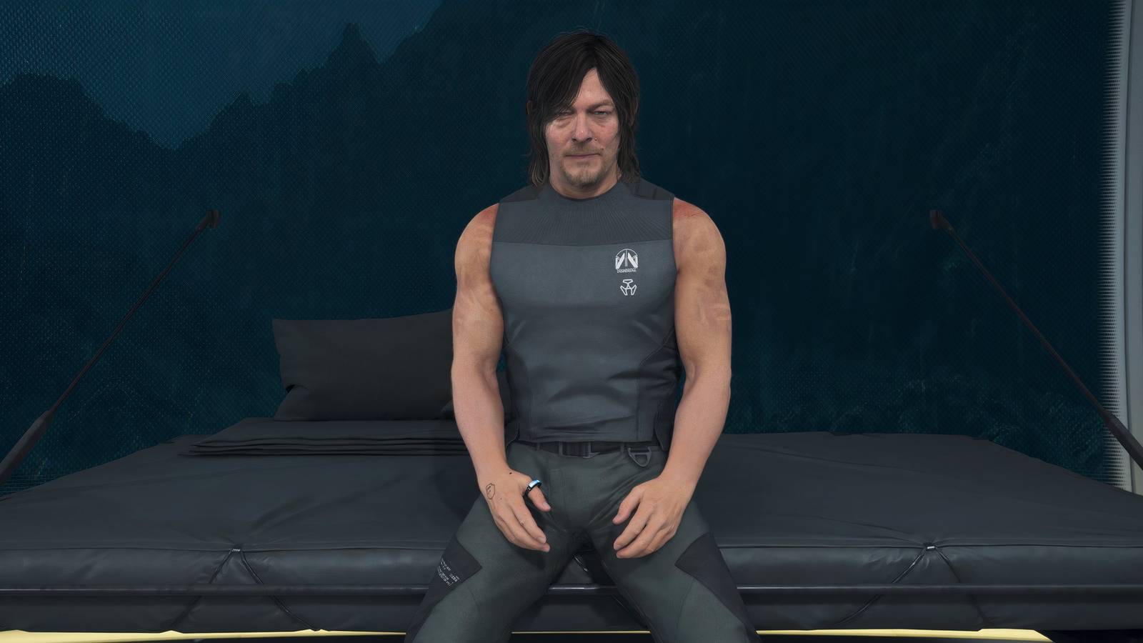 Sam sitting on a bed in Death Stranding 2 On the Beach