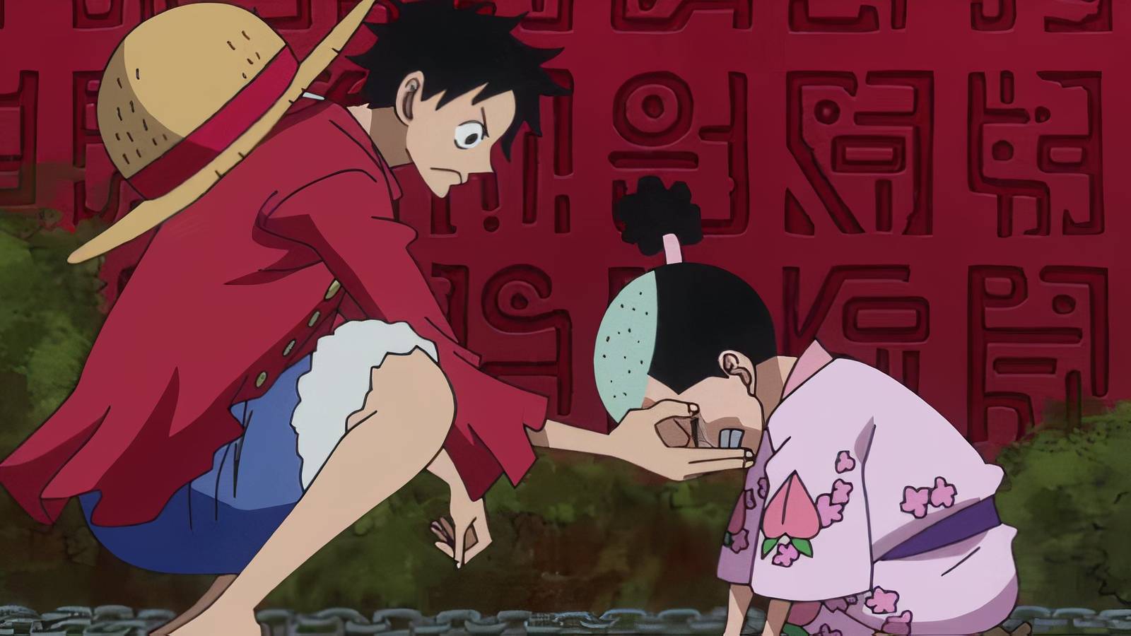 Luffy picking up Momonosuke