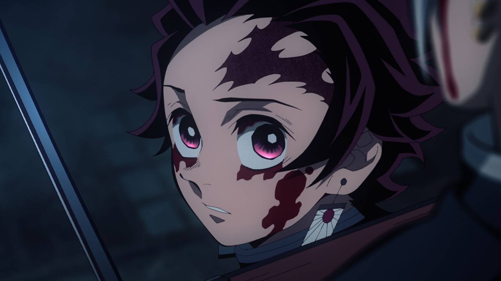 picture: tanjiro kamado with his face covered in blood in demon slayer.