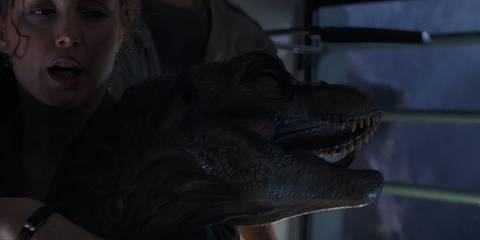 Junior, the baby T-Rex, being carried by Sarah Harding in The Lost World: Jurassic Park