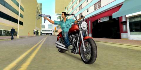 Tommy shooting a machine gun on a bike - Grand Theft Auto Vice City
