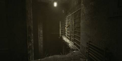 A cell with a hand peeking out in Outlast