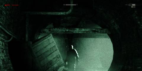 Chris Walker looking at the player in Outlast
