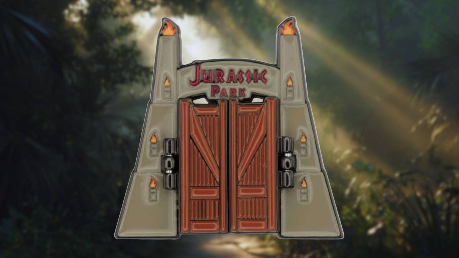 Image of tthe Jurassic Park Gate Pin on a forest background.