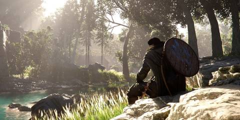 Crimson Desert character sitting near forest stream