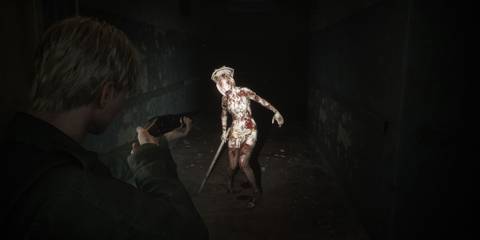 James fighting a nurse monster - Silent Hill 2