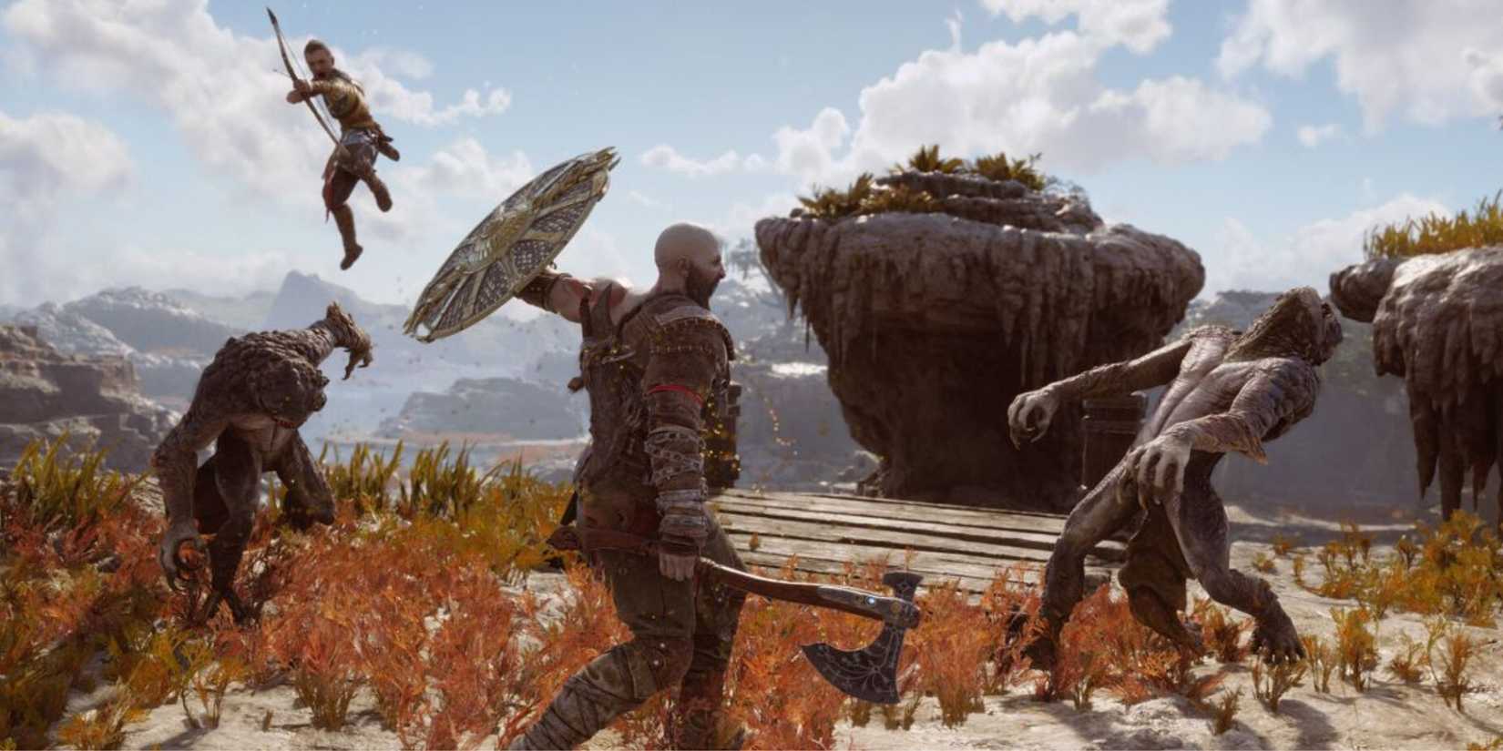 Kratos and Atreus fighting enemies together - God Of War Ragnarok