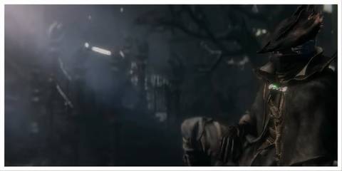 the hunter from bloodborne sat against a wall