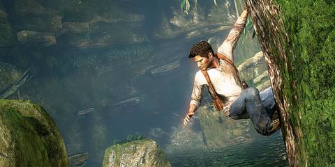 Drake hanging off a ledge