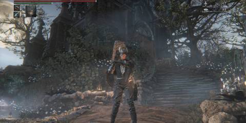 Your character prepping their weapon in Bloodborne