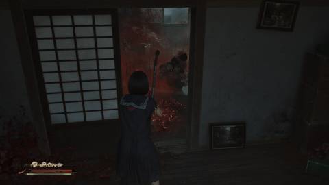 Attacking a many faced doll enemy in Silent Hill f