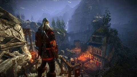 Geralt looking over a town in Witcher 2