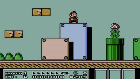Mario and a Piranha Plant in the first level - Super Mario Bros 3