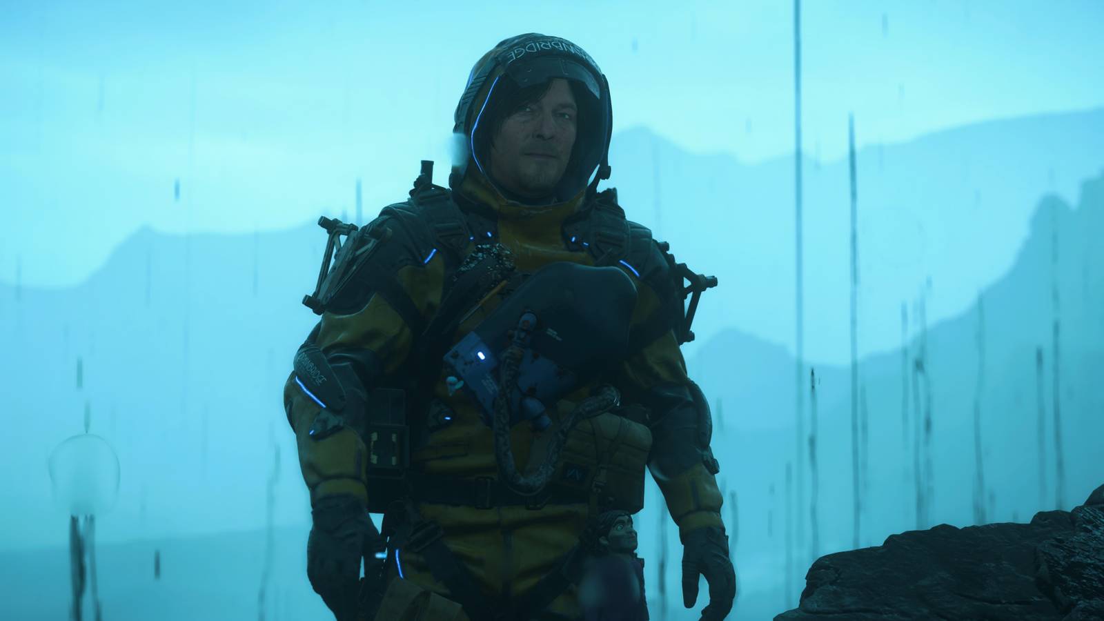 Sam in the rain in Death Stranding 2 On The Beach