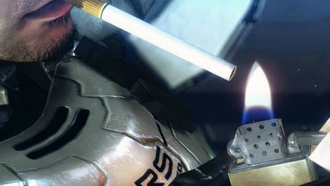 Sam lighting a cigarette