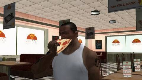 CJ eating a pizza