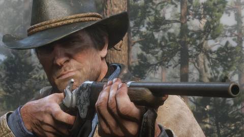 Arthur aiming and firing a rifle