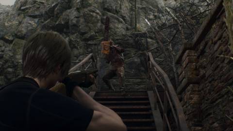 Shooting enemies with a shotgun in Resident Evil 4 (2023)