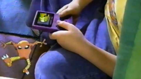The Pokemon crossing from one Game Boy to another in an old commercial - Pokemon Red and Blue