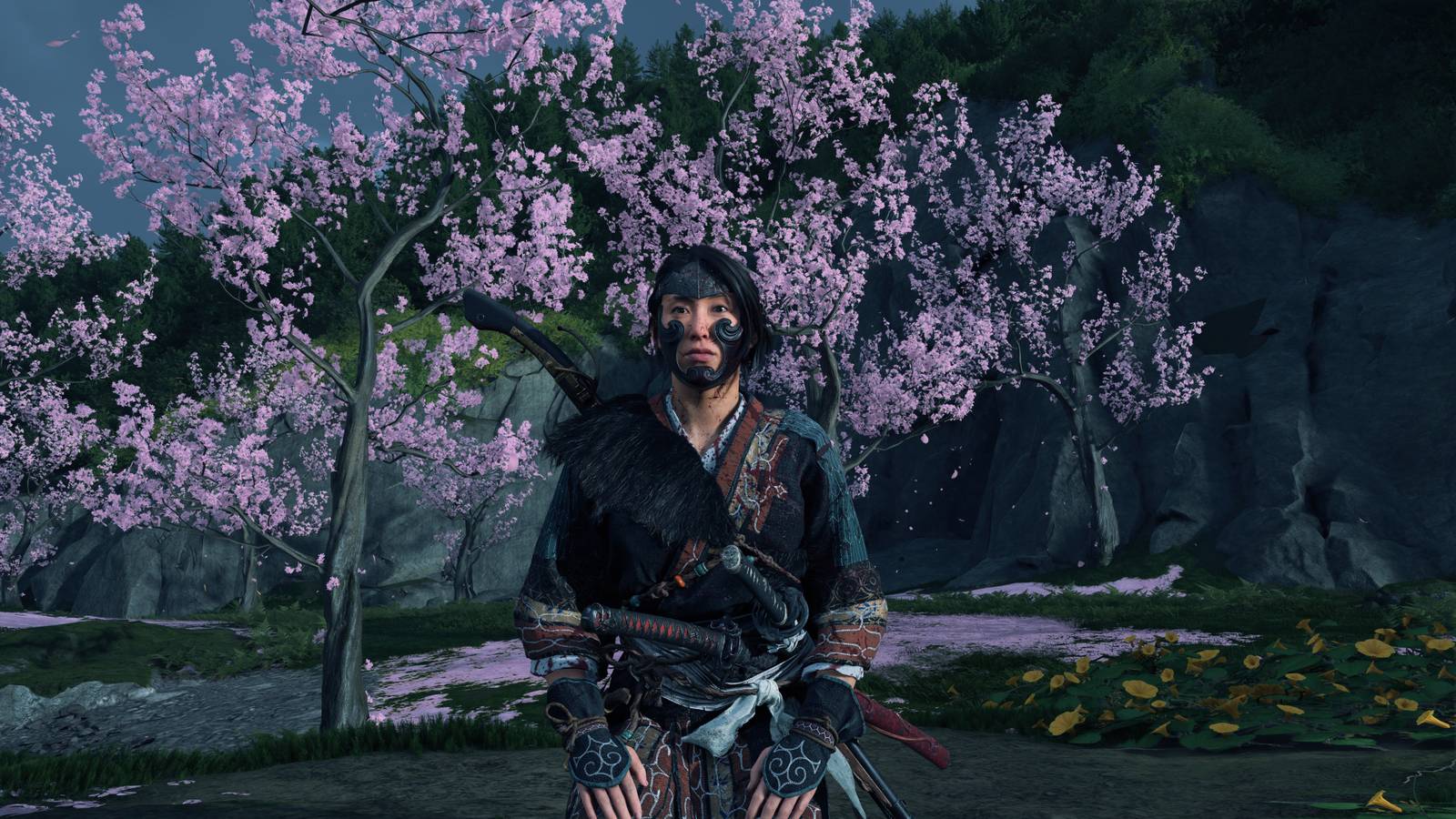 Atsu kneeling next to cherry blossoms in Ghost of Yotei