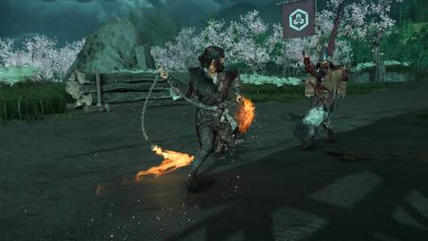 Attacking enemies with a flaming sickle in Ghost of Yotei