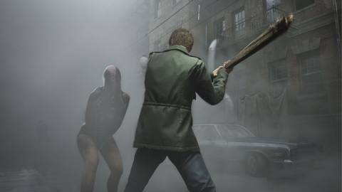 James fighting a monster emerging from the fog - Silent Hill 2