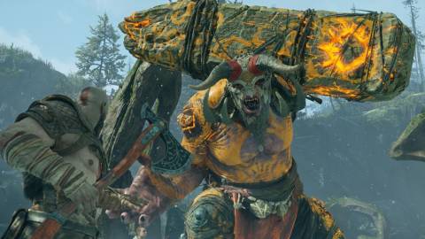 Kratos and Atreus face a giant troll - God Of War
