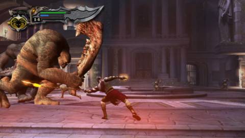 Kratos fighting a giant cyclops - God Of War