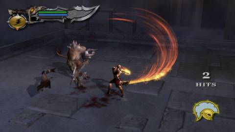 Kratos fighting a minotaur with his blades - God Of War