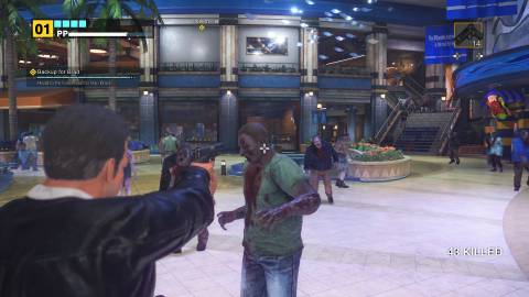 Shooting zombies in Dead Rising Deluxe Remaster