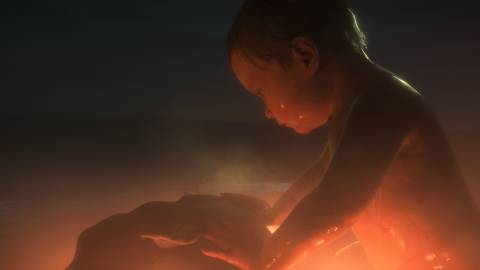 A giant baby in Death Stranding 2 On The Beach