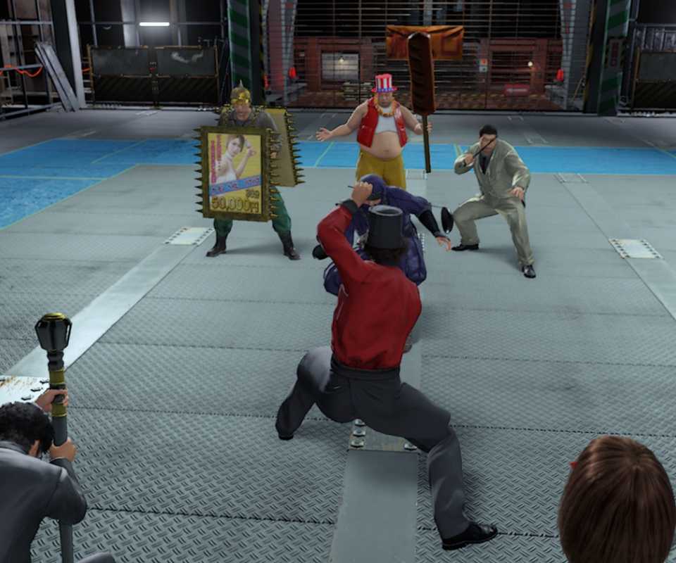 Pertarungan di arena Yakuza Like A Dragon, menunjukkan perubahan gameplay seri.