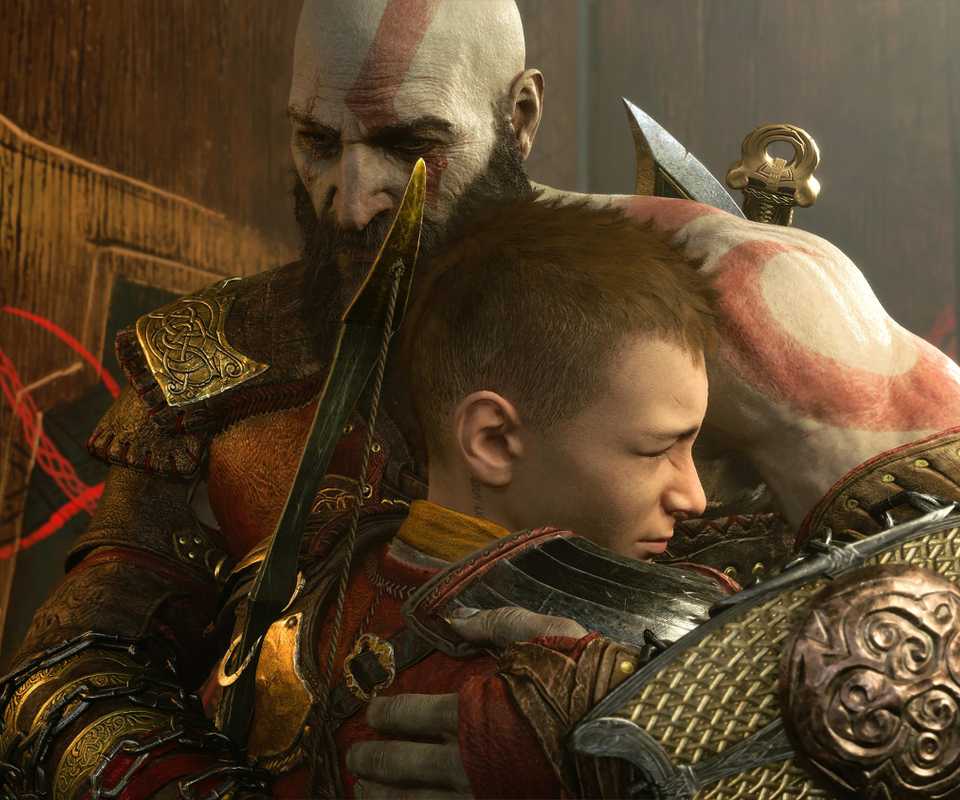 Kratos dan Atreus berpelukan di God of War Ragnarok, menunjukkan evolusi seri game.