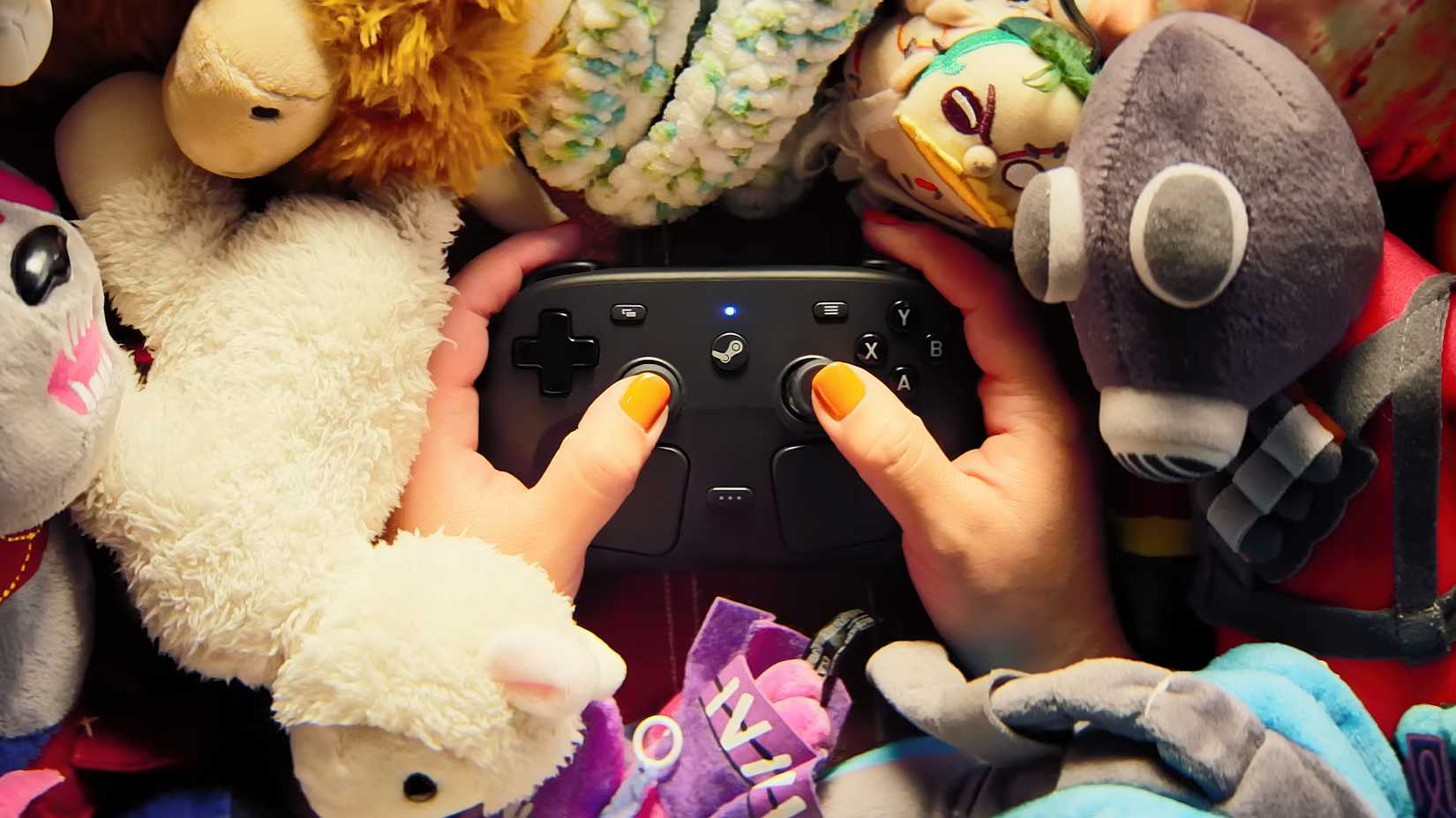 Steam controller in a pile of stuffed animals