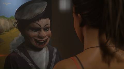 Looking at a doll in The Dark Pictures Anthology Man Of Medan