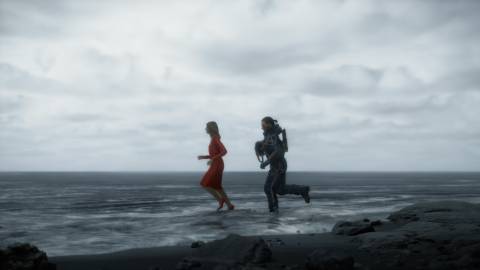 Sam and Amelia running on a beach in Death Stranding (2019)