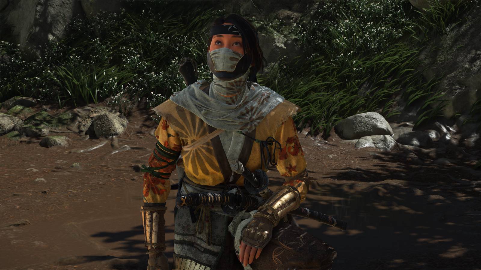 Atsu kneeling in Ghost Of Yotei (2025)