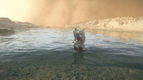 Crossing a river in Death Stranding 2 On the Beach (2025)